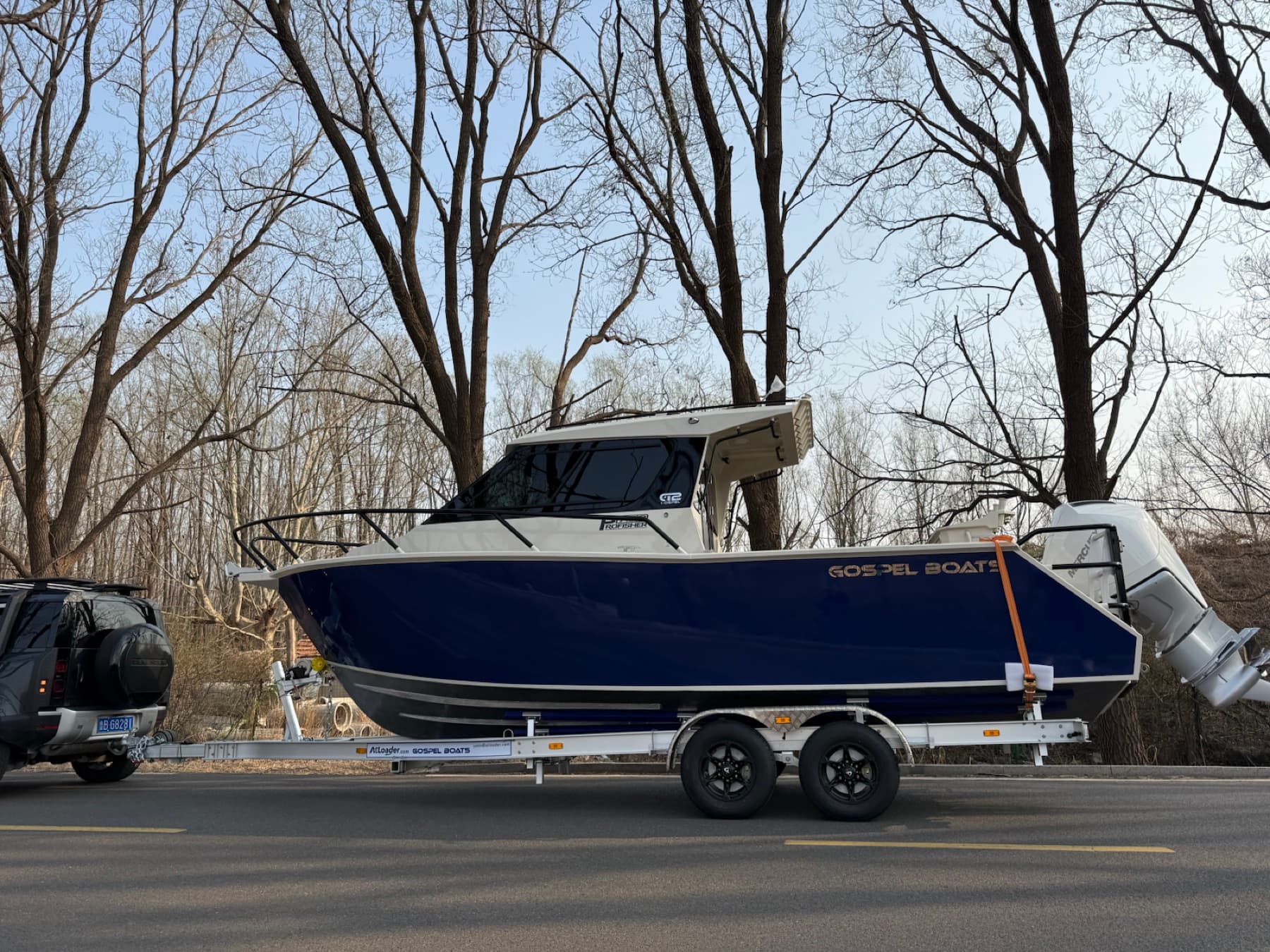 Close side view of an ATLL860 example trailer and boat package